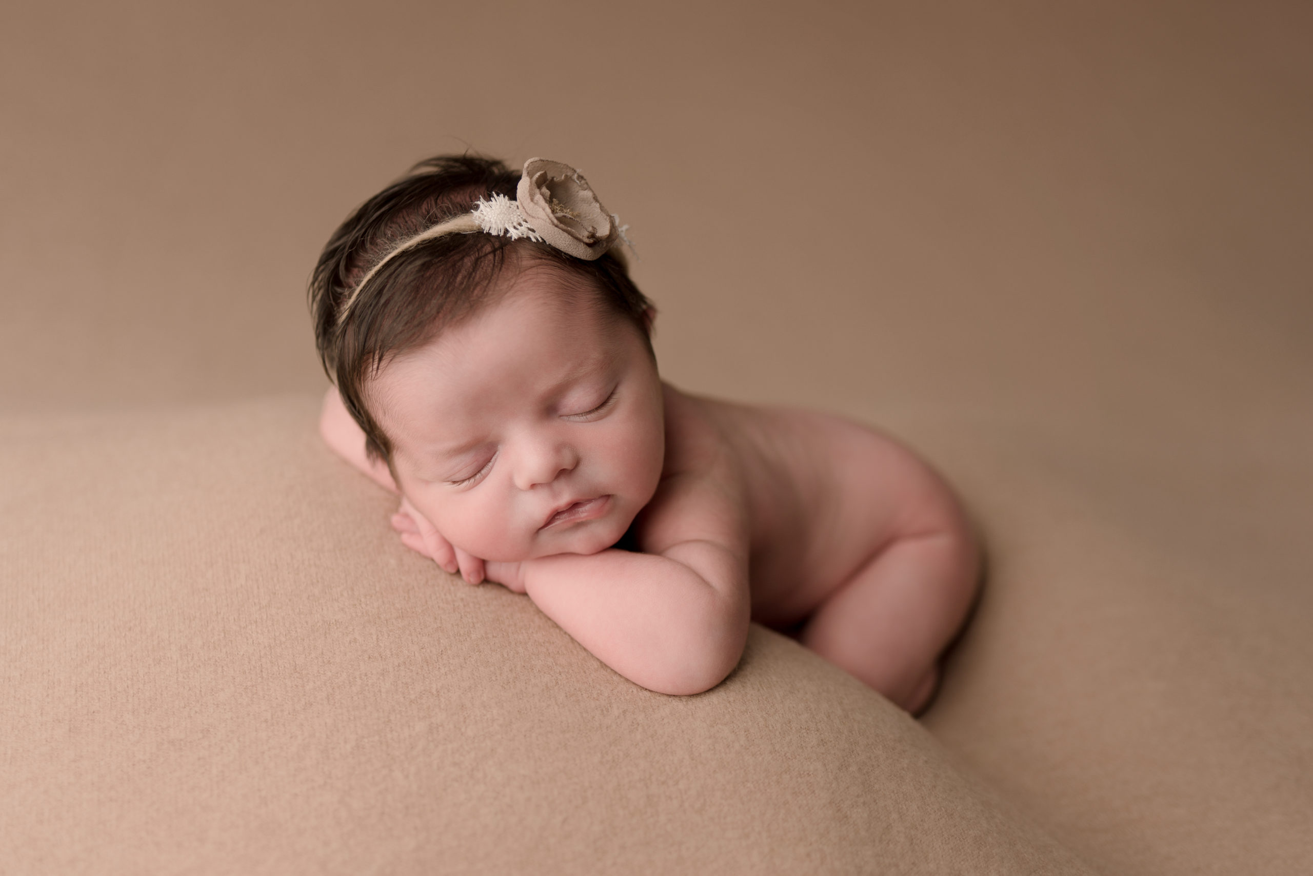 Pensacola, FL Newborn Photographer. Newborn Girl Posed Chin on Hands