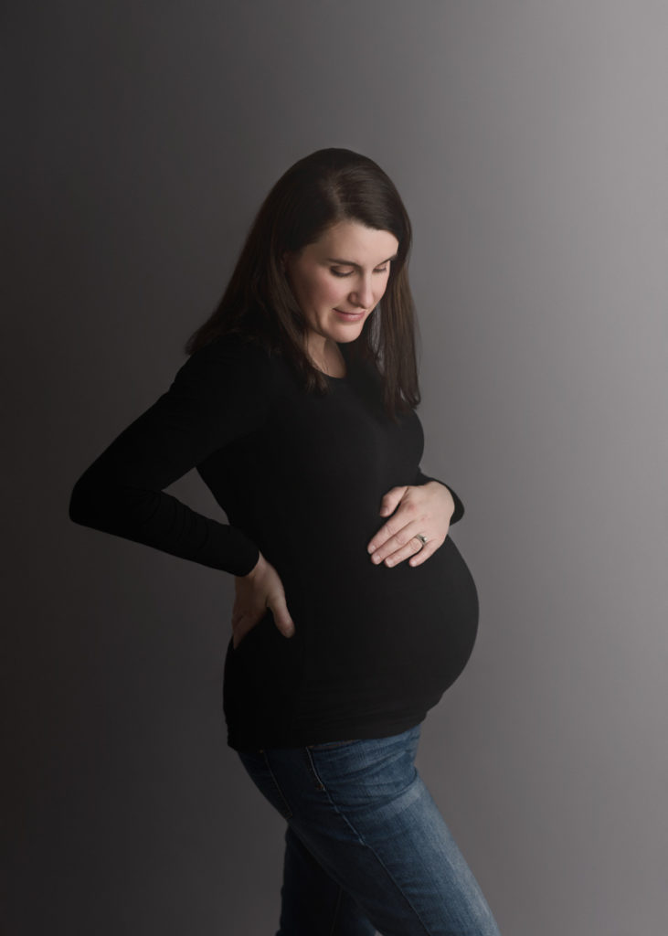 Navarre, Florida Maternity Photographer, Expecting mother holding belly