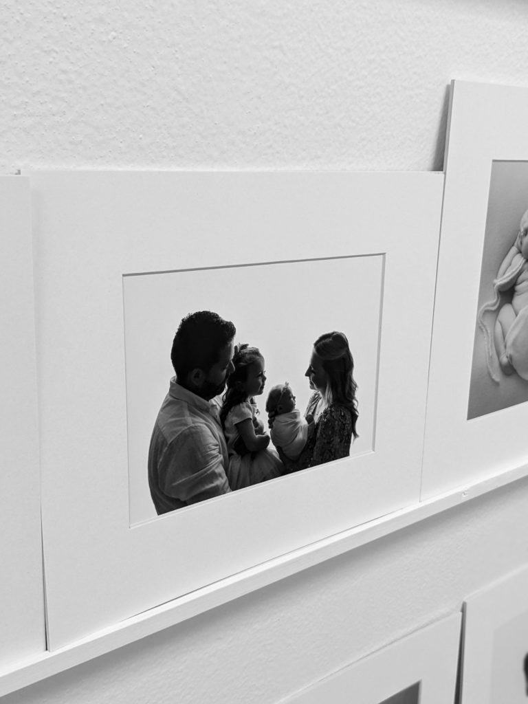 Image of backlit family framed and displayed on a shelf